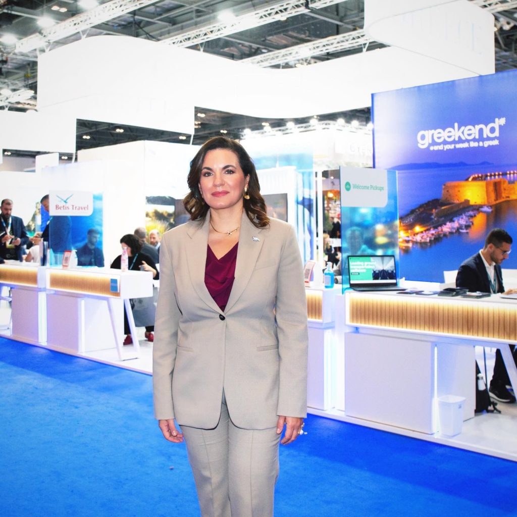 Olga Kefalogianni standing in front of a display